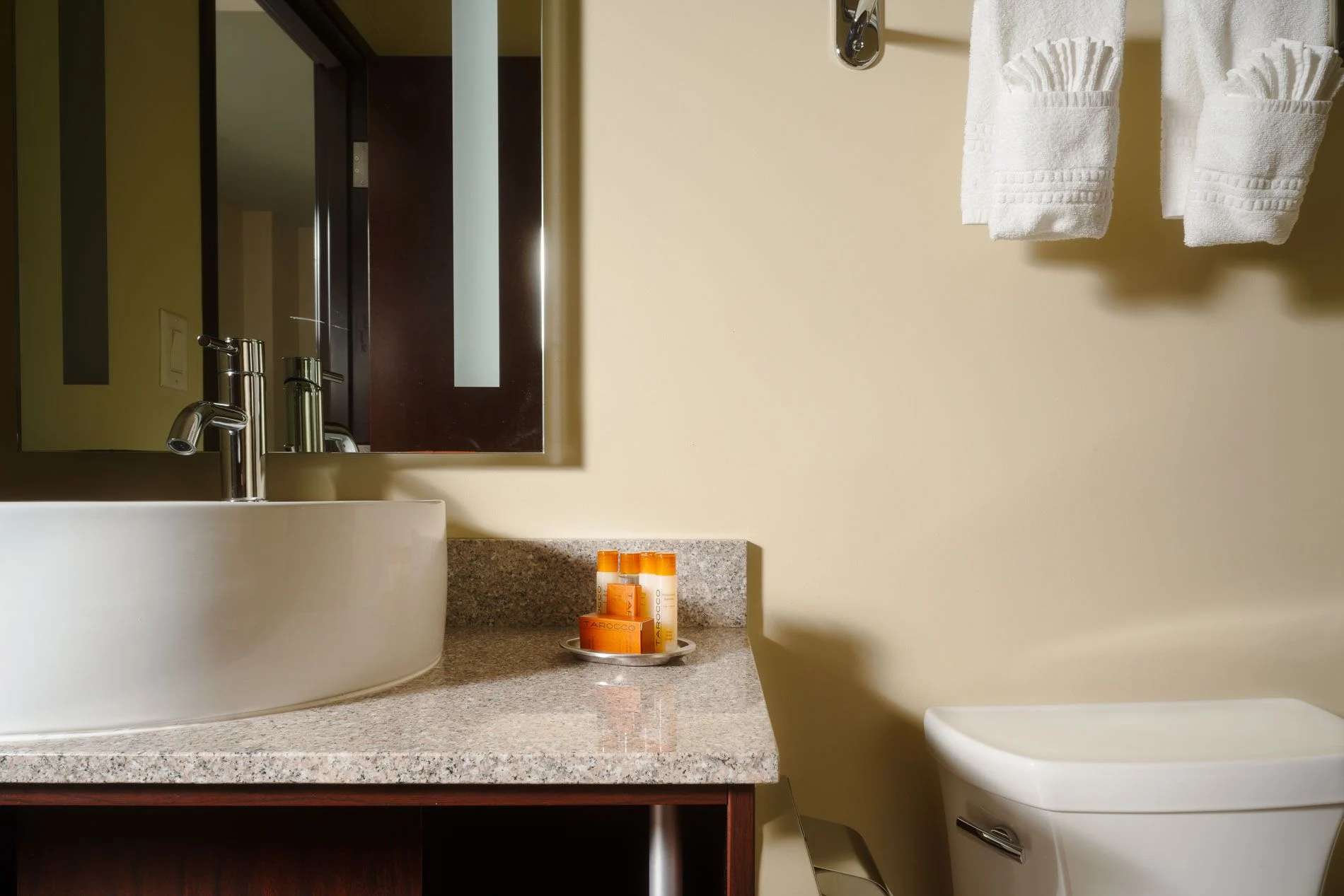 Renovated guest bathroom at the Northern Hotel with stone counters and modern fixtures